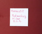 Front of label for Hematite from Postmasburg, South Africa.