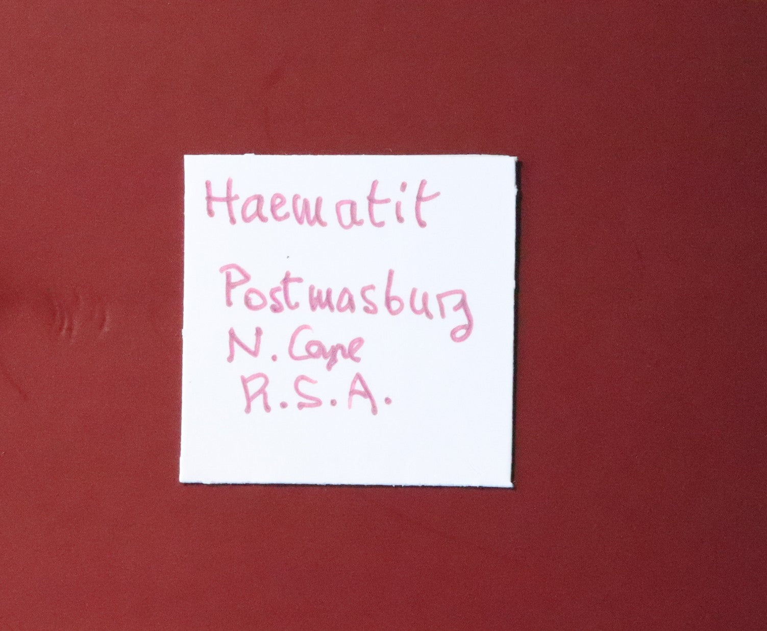 Front of label for Hematite from Postmasburg, South Africa.