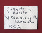 Front of label for Gageite in Barite thumbnail from N'Chwaning, South Africa. Ex. Clive Queit.