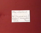 Front of label for Mangano Calcite thumbnail from N'Chwaning II, South Africa. 