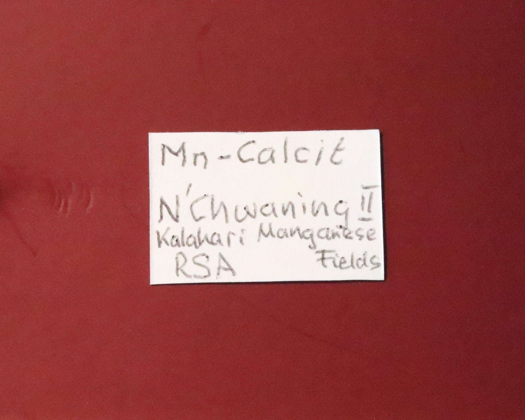 Front of label for Mangano Calcite thumbnail from N'Chwaning II, South Africa. 