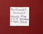Front of label for nice combination of Portlandite with Sturmanite from Wessels Mine, Kalahari Manganese Fields, South Africa