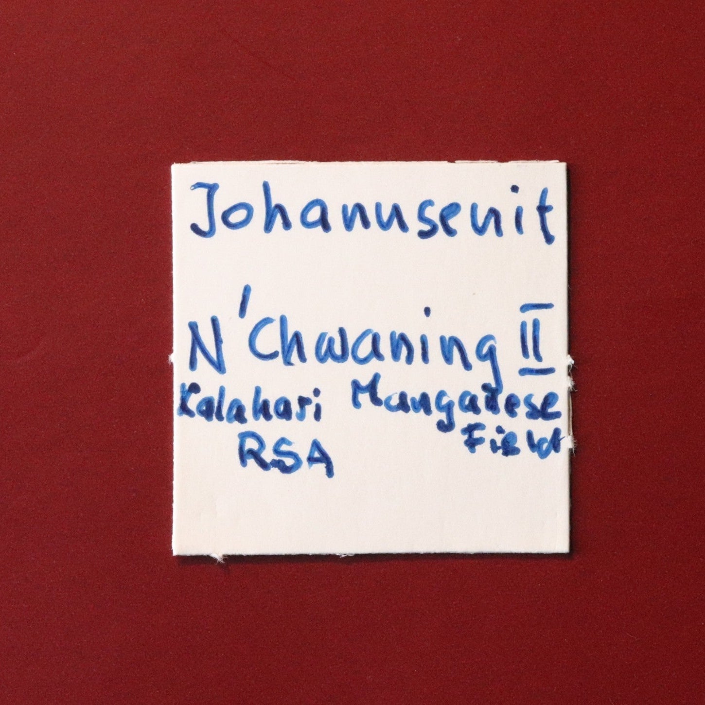 Front of label for rare Johannsenite mineral specimen from N'Chwaning II, Kalahari Manganese Fields, South Africa