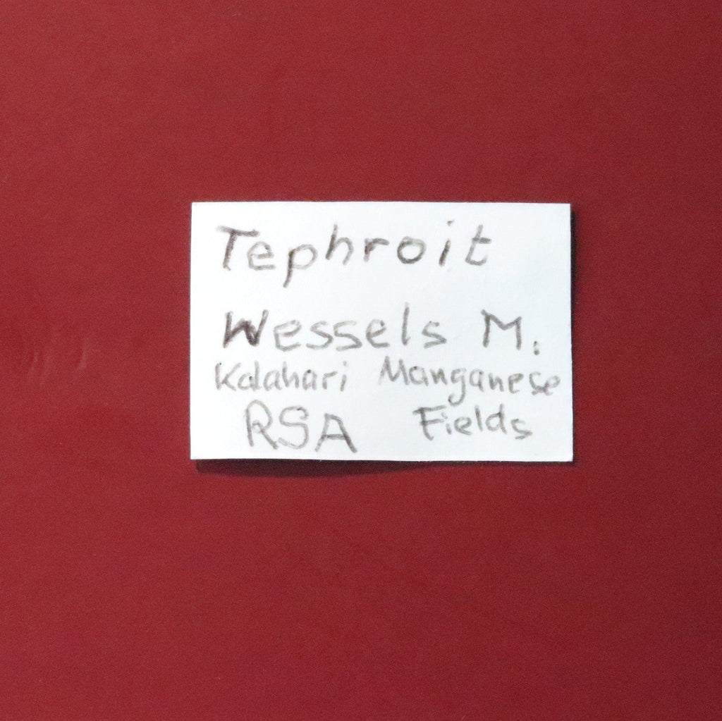 Front of label of Tephroite from Wessels Mine, South Africa