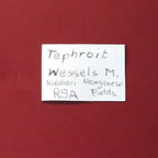 Front of label of Tephroite from Wessels Mine, South Africa