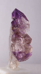 First side view of Amethyst Sceptres on a Quartz Point