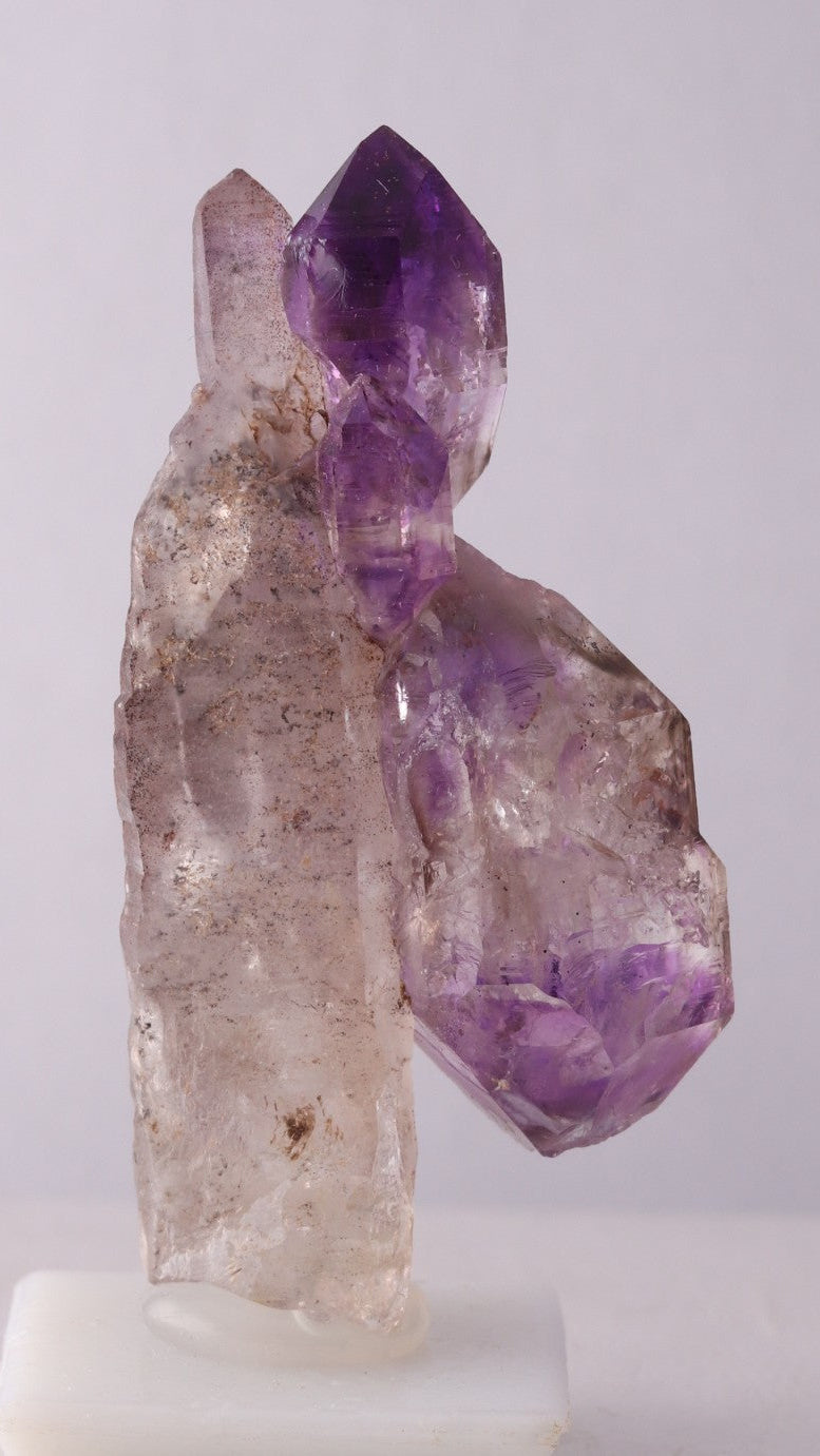 Second side view of Amethyst Sceptres on a Quartz Point