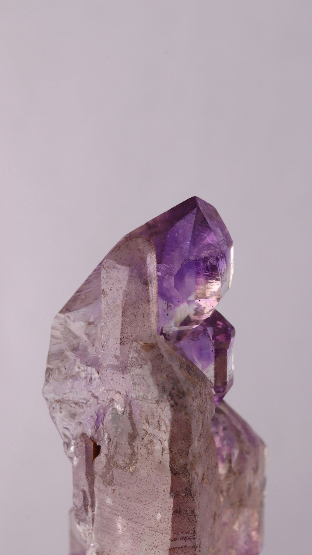 Close-up of top Amethyst sceptre on Quartz point
