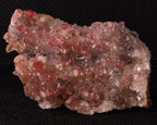 Front view of Cinnabar included in Calcite from N'Chwaning II, Kalahari Manganese Fields, South Africa