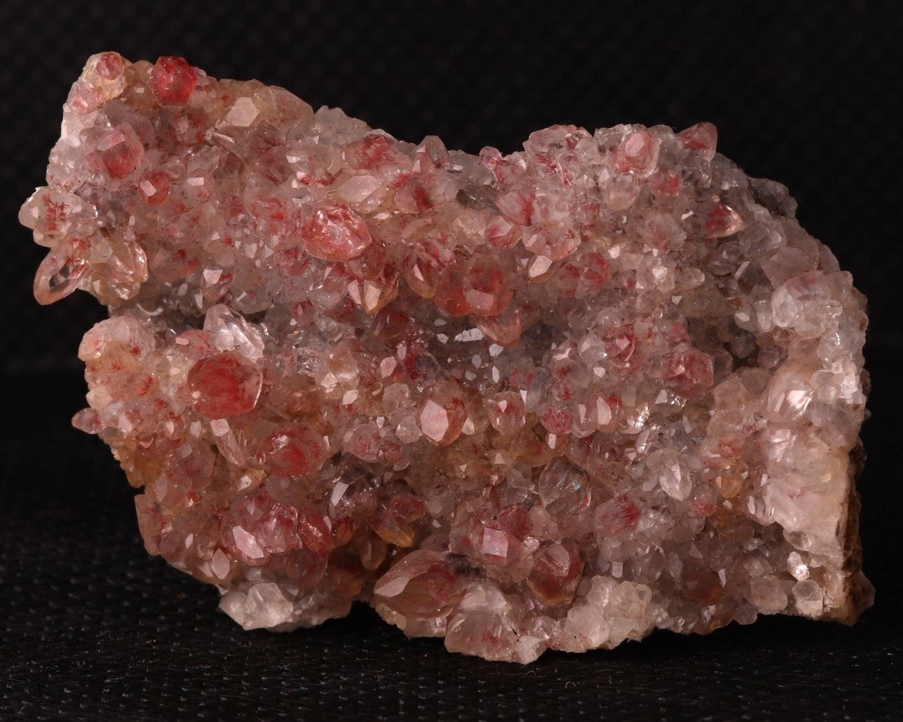 Front view of Cinnabar included in Calcite from N'Chwaning II, Kalahari Manganese Fields, South Africa