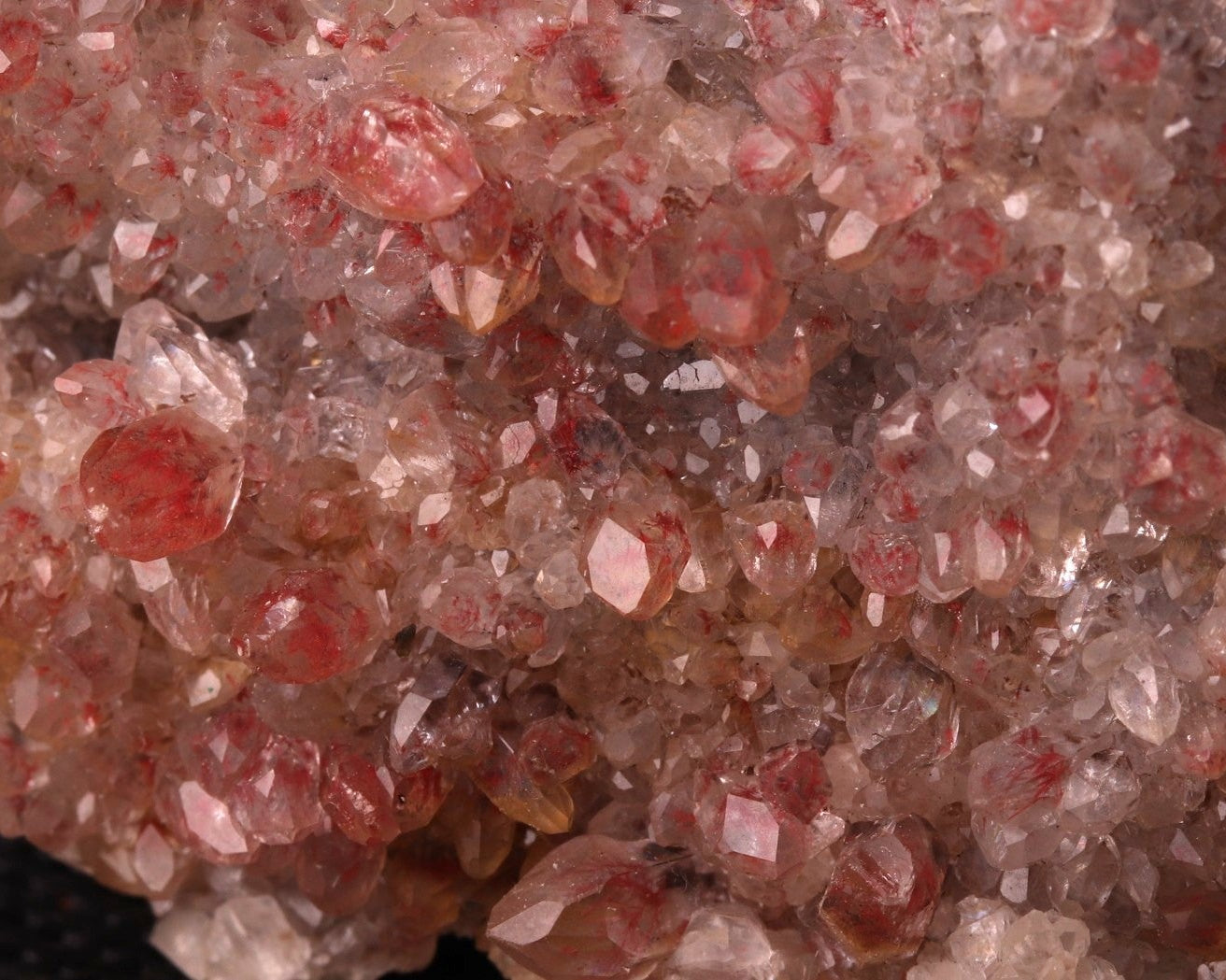 Close-up view of Cinnabar included in Calcite from N'Chwaning II, Kalahari Manganese Fields, South Africa