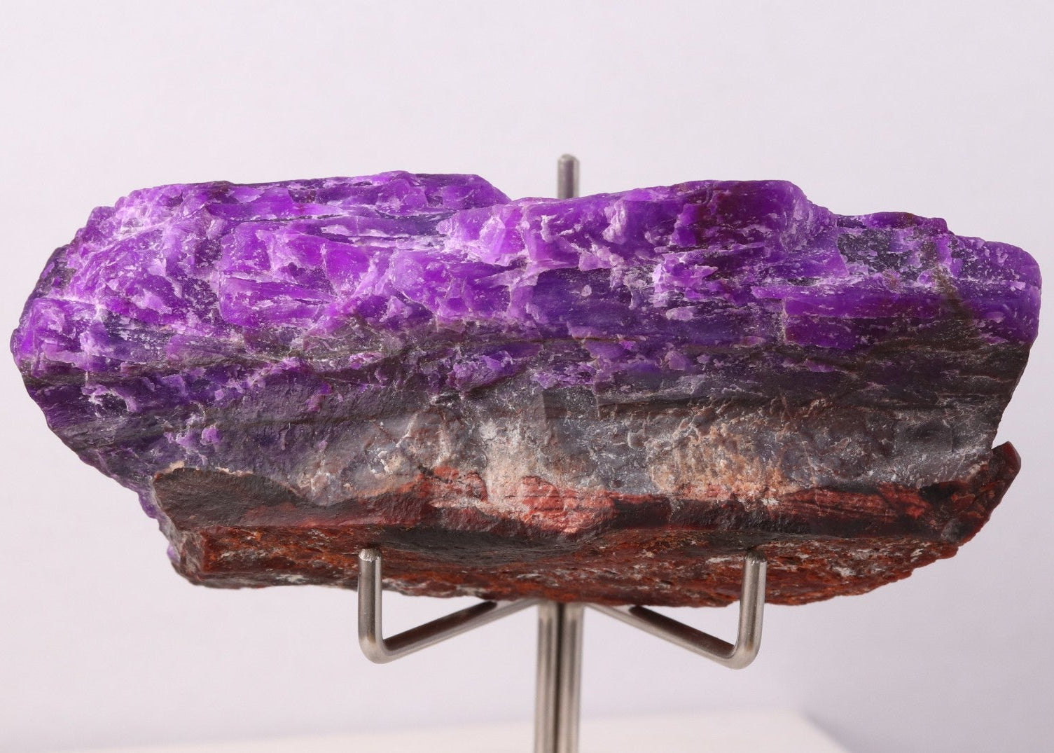 Side view of deep purple Sugilite mineral specimen from Wessels Mine, South Africa