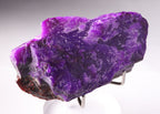 Close-up view of light shinning through deep purple Sugilite from Wessels Mine, South Africa