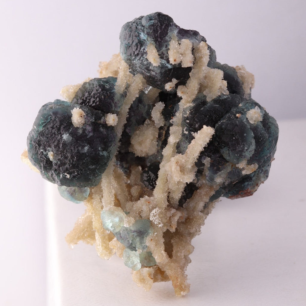 Front view of adorable blue Fluorite balls with unknown.