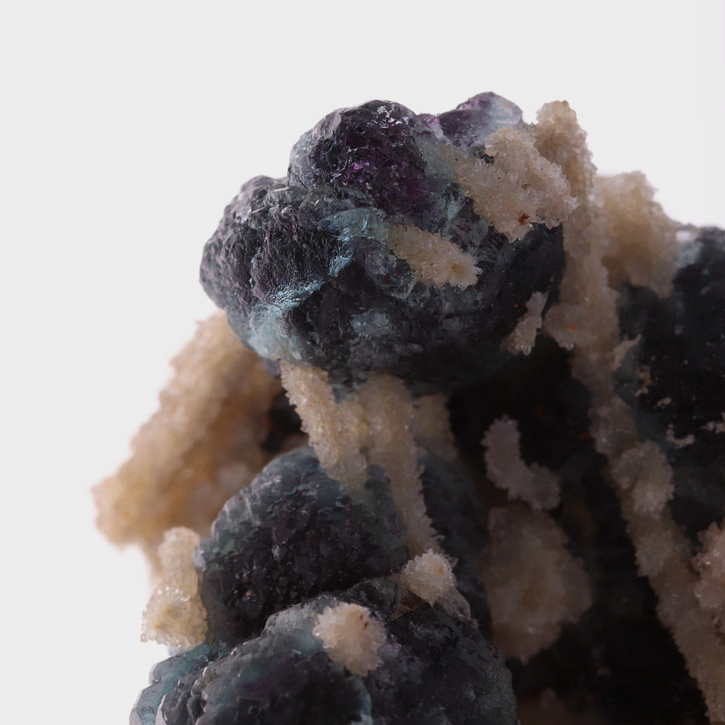 Close-up view of adorable blue Fluorite balls with unknown.