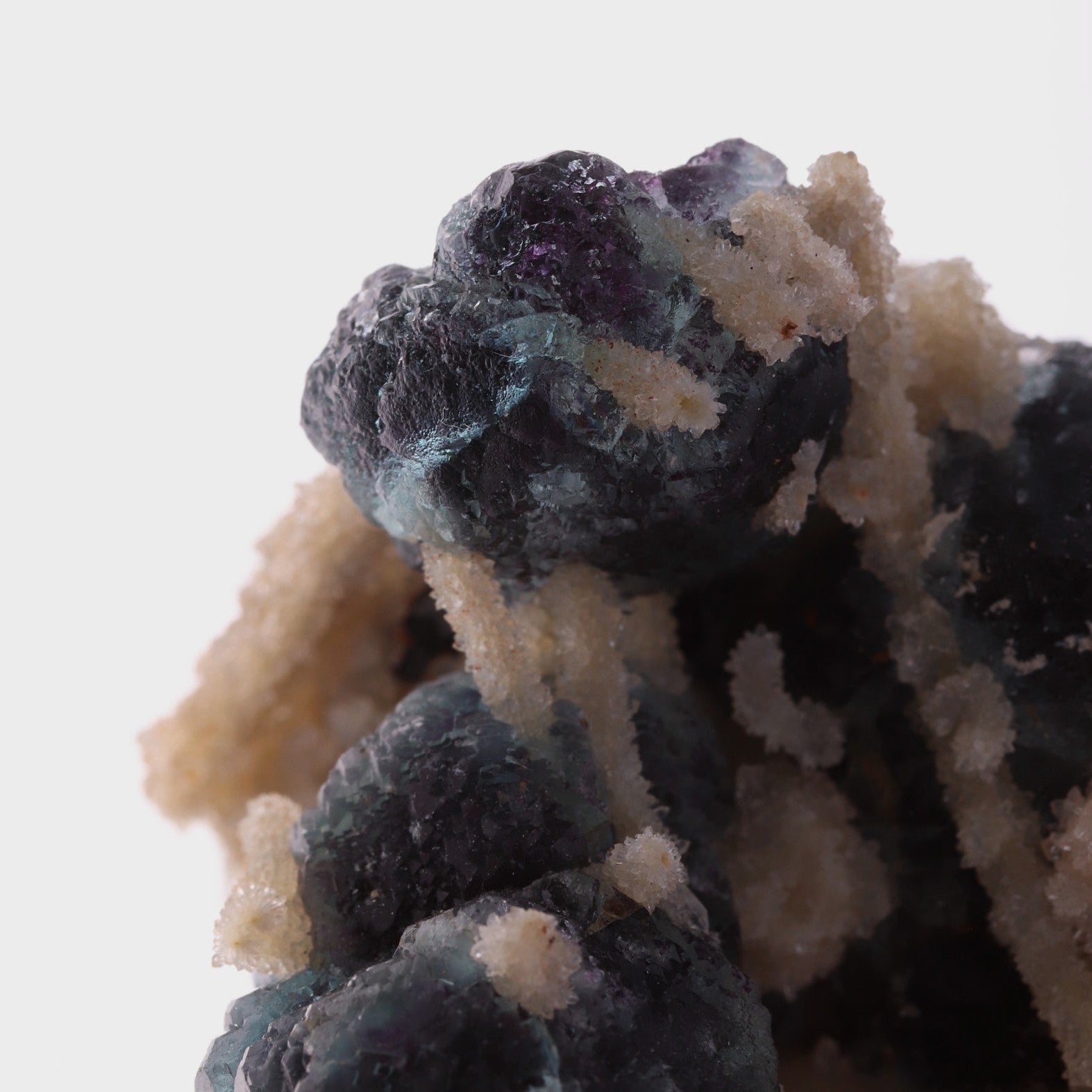 Close-up view of adorable blue Fluorite balls with unknown.