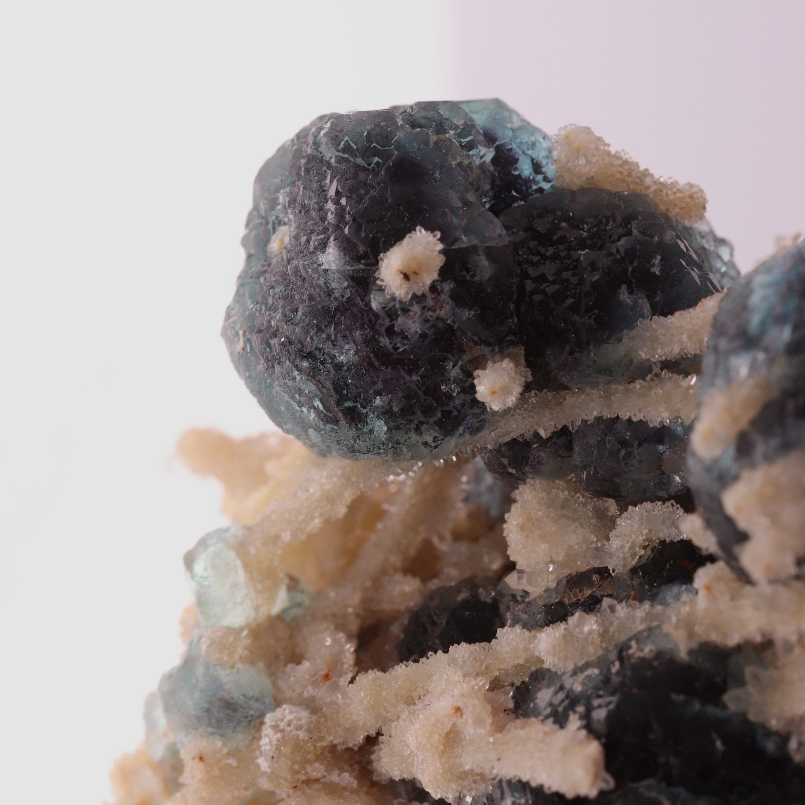 Close-up view of adorable blue Fluorite balls with unknown.
