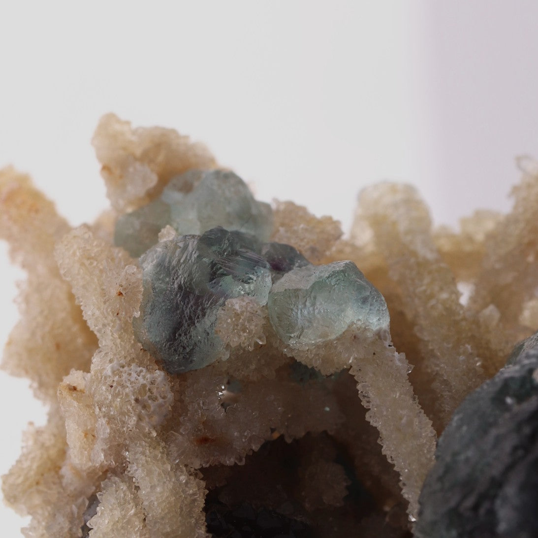 Close-up view of adorable blue Fluorite balls with unknown.