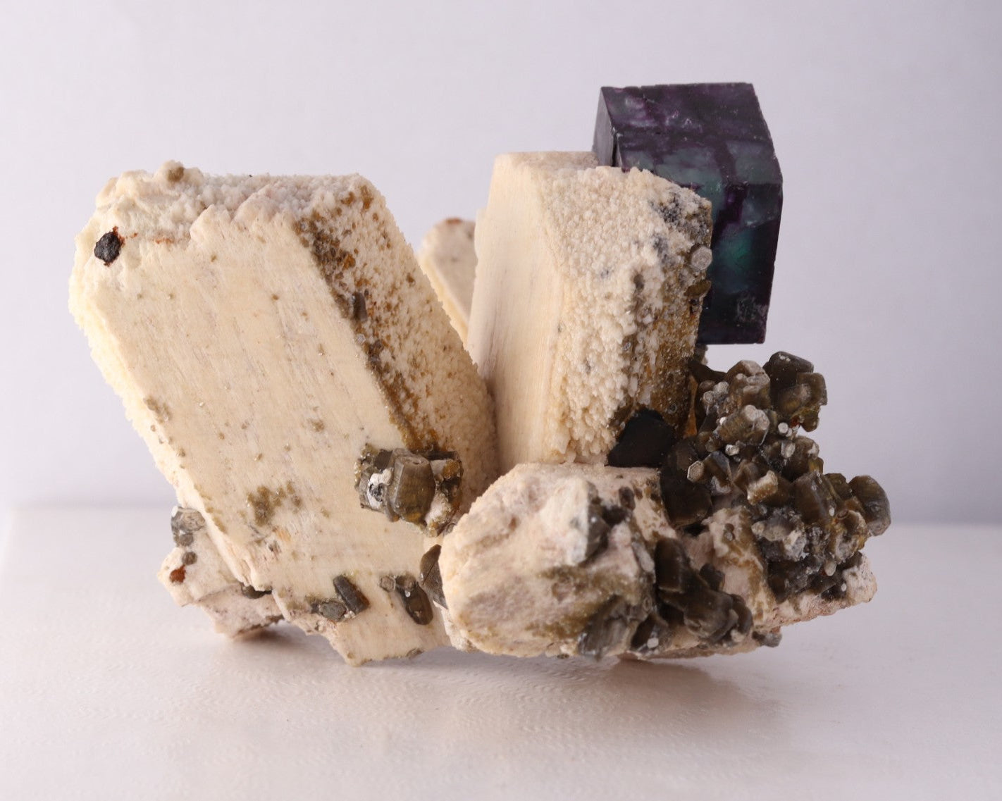 Side view of gorgeous blue-purple Fluorite cube on Feldspar from Erongo Region, Namibia