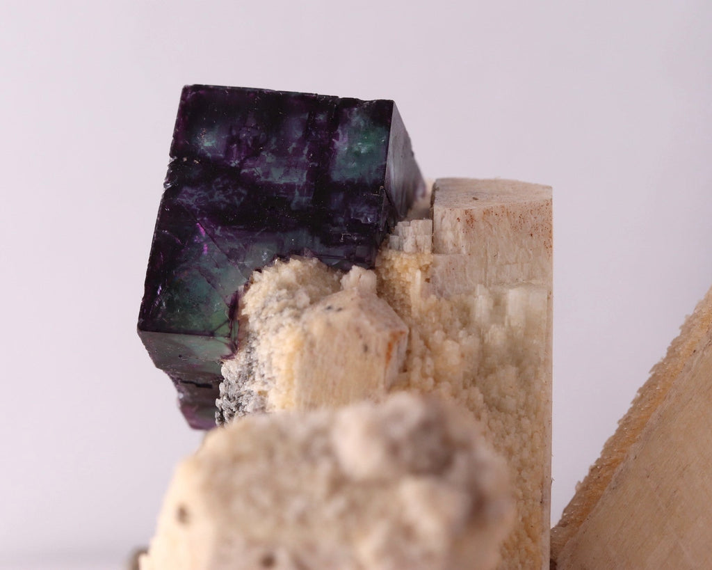 Close-up view of gorgeous blue-purple Fluorite cube on Feldspar from Erongo Region, Namibia