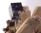 Close-up view of gorgeous blue-purple Fluorite cube on Feldspar from Erongo Region, Namibia