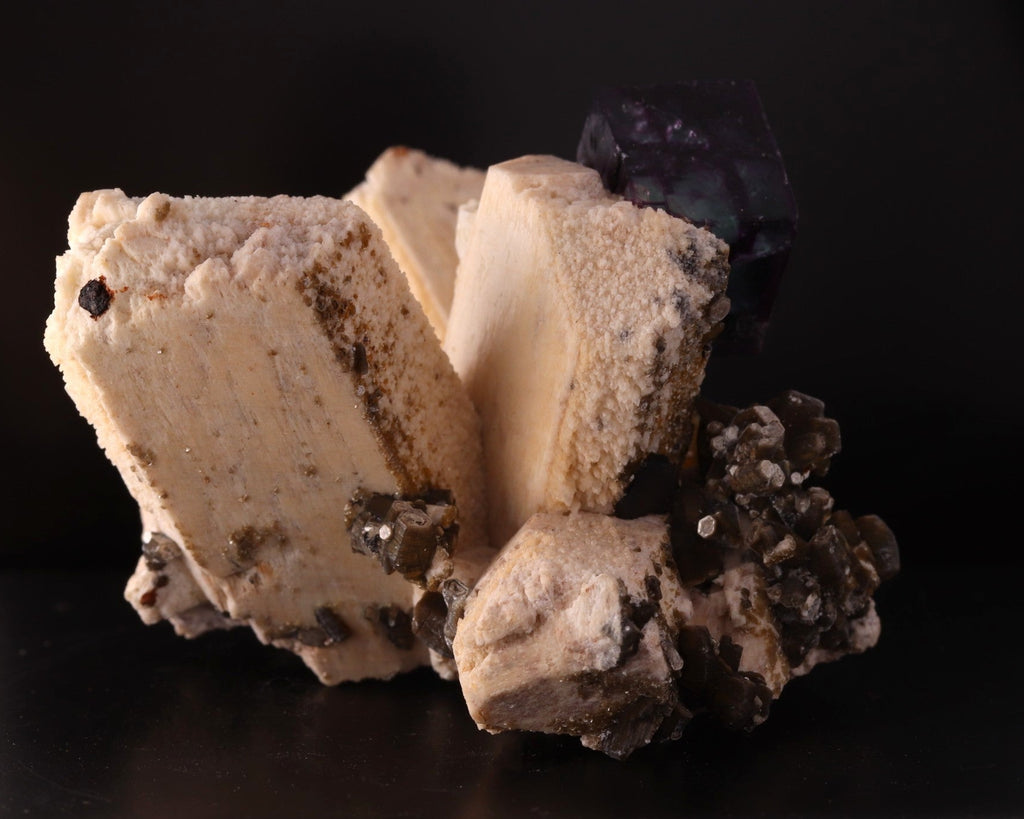 Side view of gorgeous blue-purple Fluorite cube on Feldspar from Erongo Region, Namibia