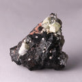Front view of Hausmannite, Ettringite and Andradite mineral specimen from N'Chwaning II, Kalahari Manganese Fields, South Africa