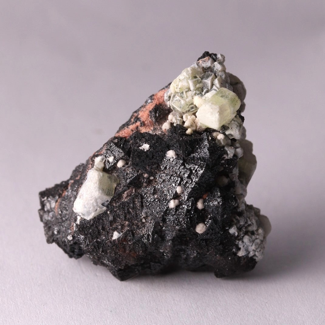 Front view of Hausmannite, Ettringite and Andradite mineral specimen from N'Chwaning II, Kalahari Manganese Fields, South Africa