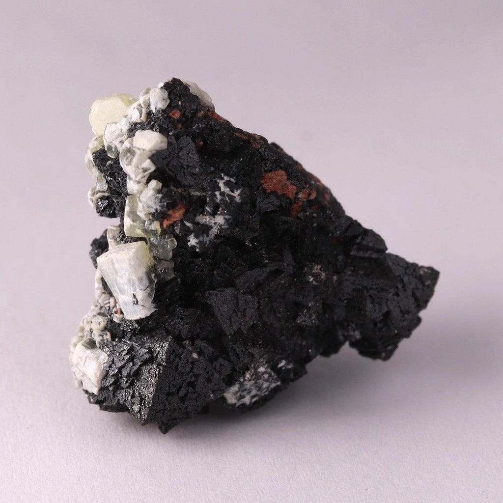 Back view of Hausmannite, Ettringite and Andradite mineral specimen from N'Chwaning II, Kalahari Manganese Fields, South Africa