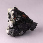 Back view of Hausmannite, Ettringite and Andradite mineral specimen from N'Chwaning II, Kalahari Manganese Fields, South Africa