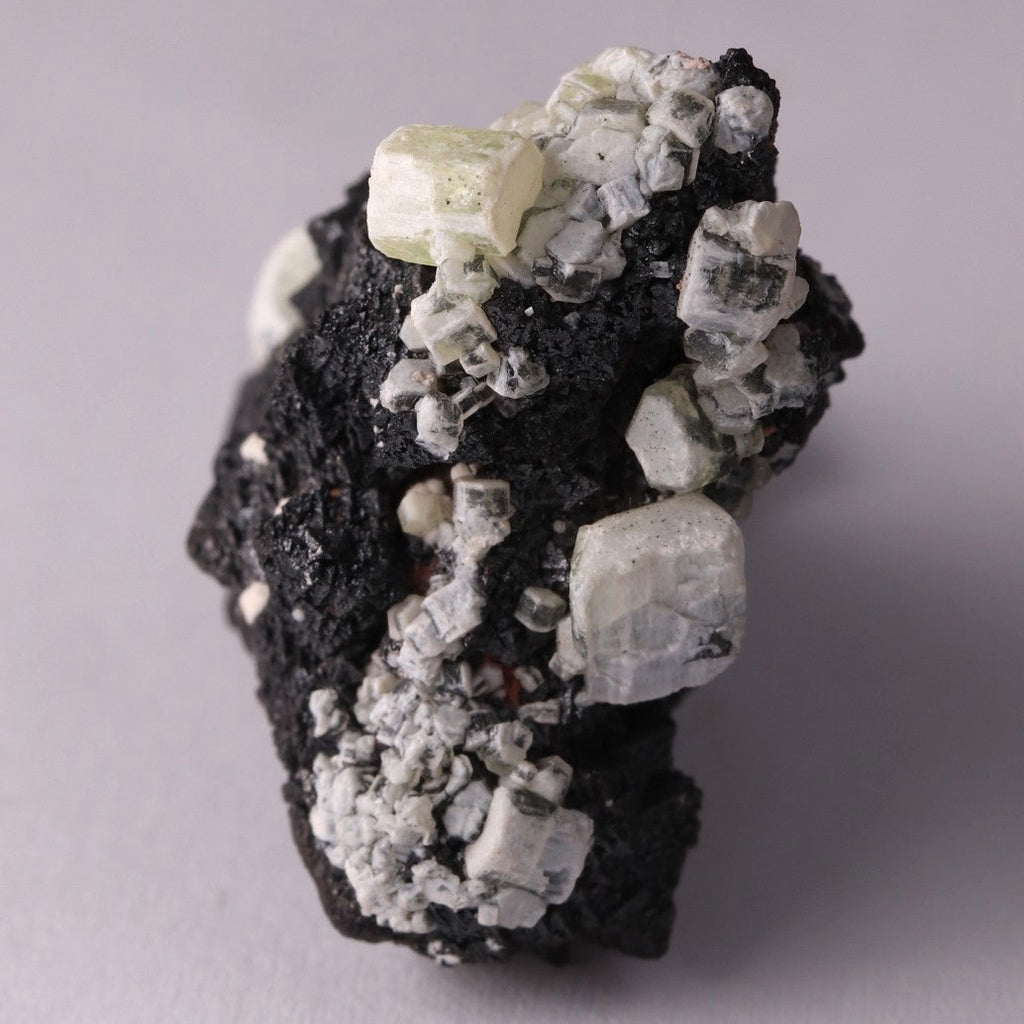 Side view of Hausmannite, Ettringite and Andradite mineral specimen from N'Chwaning II, Kalahari Manganese Fields, South Africa