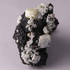 Side view of Hausmannite, Ettringite and Andradite mineral specimen from N'Chwaning II, Kalahari Manganese Fields, South Africa