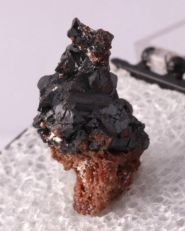 Side view of Hausmannite thumbnail from N'Chwaning, South Africa. Ex. Clive Queit.