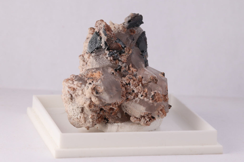 Side view of beautiful lustrous Hematite with Calcite mineral specimen from N'Chwaning II, KMF (Kalahari Manganese Fields), South Africa