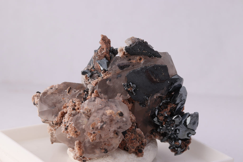 Close-up front view of beautiful lustrous Hematite with Calcite mineral specimen from N'Chwaning II, KMF (Kalahari Manganese Fields), South Africa