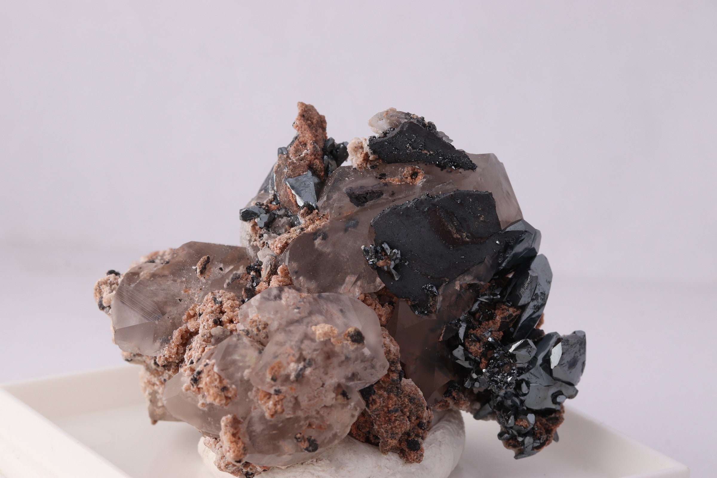 Close-up front view of beautiful lustrous Hematite with Calcite mineral specimen from N'Chwaning II, KMF (Kalahari Manganese Fields), South Africa