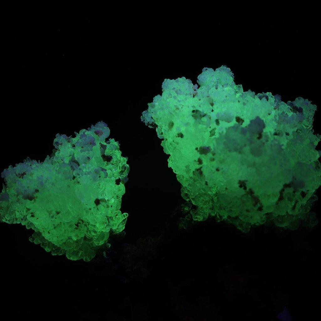 Both sprays fluorescing of super cute fluorescent Hyalite from Erongo, Namibia