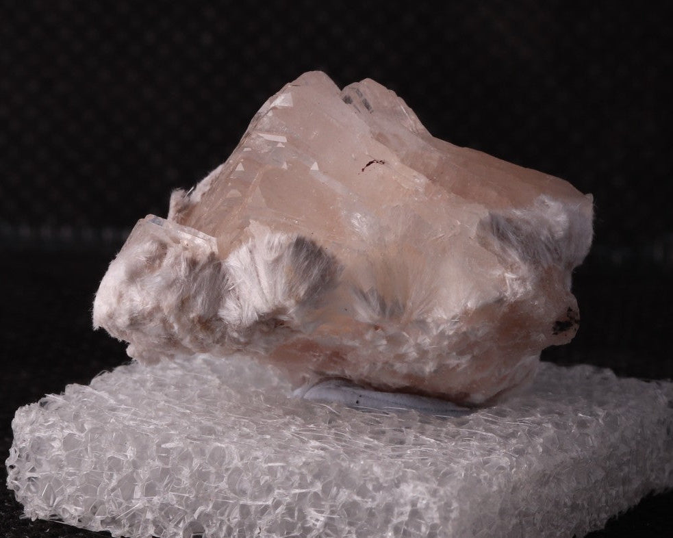 Hydroxyapophyllite with Tobermorite from Wessels Mine, South Africa. Side view.