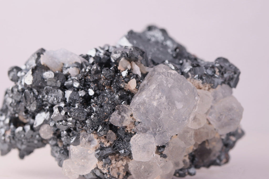 Close-up view of gorgeous lustrous Hematite with Calcite mineral specimen from N'Chwaning III, Kalahari Manganese Fields, South Africa