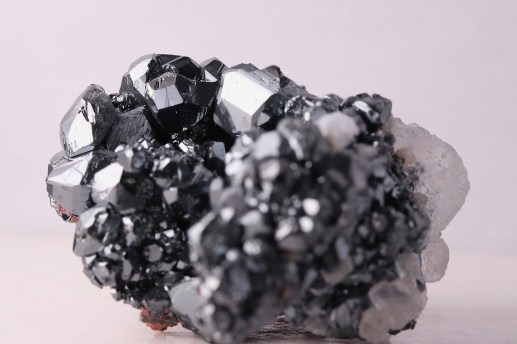 Side close-up view of gorgeous lustrous Hematite with Calcite mineral specimen from N'Chwaning III, Kalahari Manganese Fields, South Africa