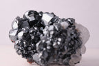 Side close-up view of gorgeous lustrous Hematite with Calcite mineral specimen from N'Chwaning III, Kalahari Manganese Fields, South Africa