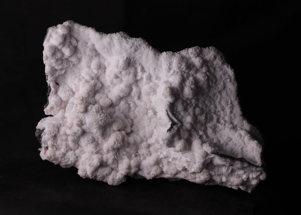 Back view of fluorescent Mangano-Calcite mineral specimen from N'Chwaning II, Kalahari Manganese Fields, South Africa