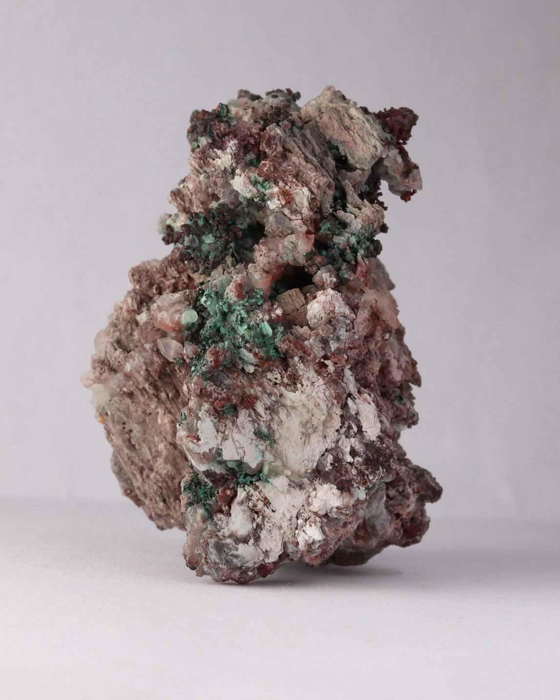 Side view of Native Copper with Calcite and Malachite mineral specimen from Tsumeb, Oshikoto Region, Namibia
