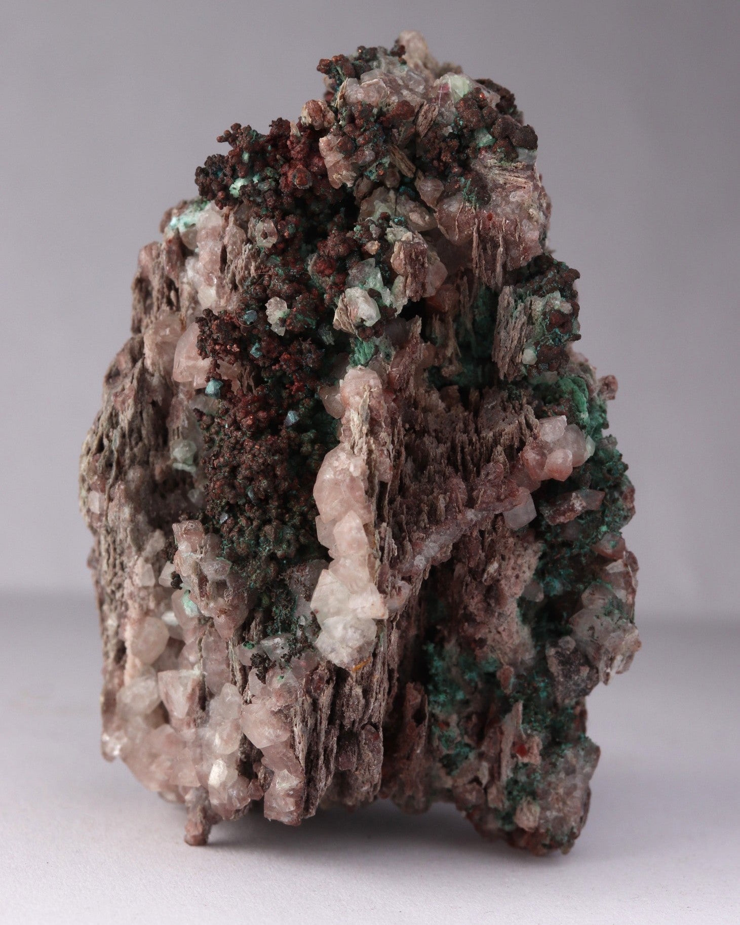 Close-up front view of Native Copper with Calcite and Malachite mineral specimen from Tsumeb, Oshikoto Region, Namibia