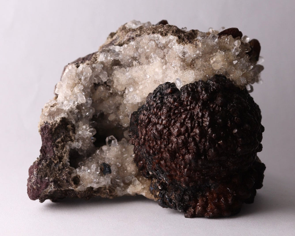 Front view of dark brown Olmiite with Calcite mineral specimen from N'Chwaning, Kalahari Manganese Fields, South Africa
