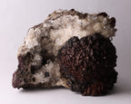 Front view of dark brown Olmiite with Calcite mineral specimen from N'Chwaning, Kalahari Manganese Fields, South Africa