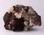 Side view of dark brown Olmiite with Calcite mineral specimen from N'Chwaning, Kalahari Manganese Fields, South Africa