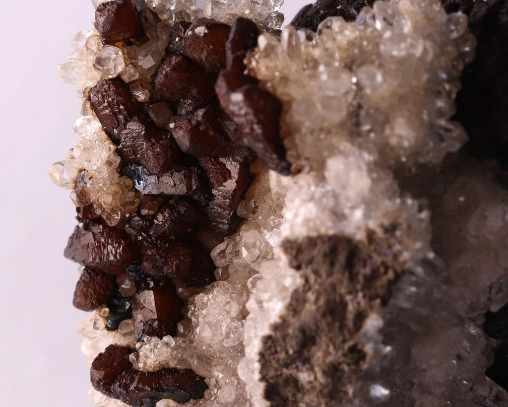Close-up view of dark brown Olmiite with Calcite mineral specimen from N'Chwaning, Kalahari Manganese Fields, South Africa