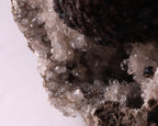 Close-up view of dark brown Olmiite with Calcite mineral specimen from N'Chwaning, Kalahari Manganese Fields, South Africa