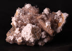Front view of Oyelite with Calcite mineral specimen from N'Chwaning II, Kalahari Manganese Fields, South Africa